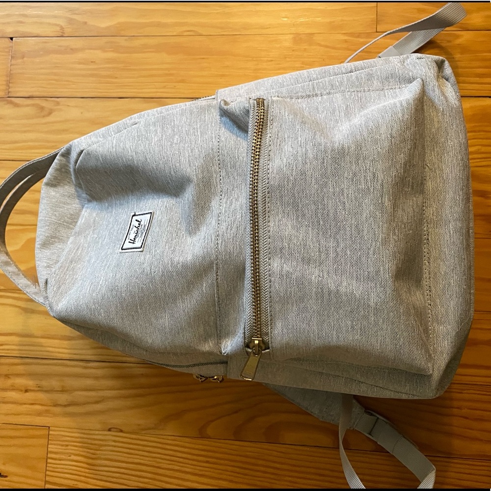 Herschel light gray backpack, gold zippers. Brand new condition!
